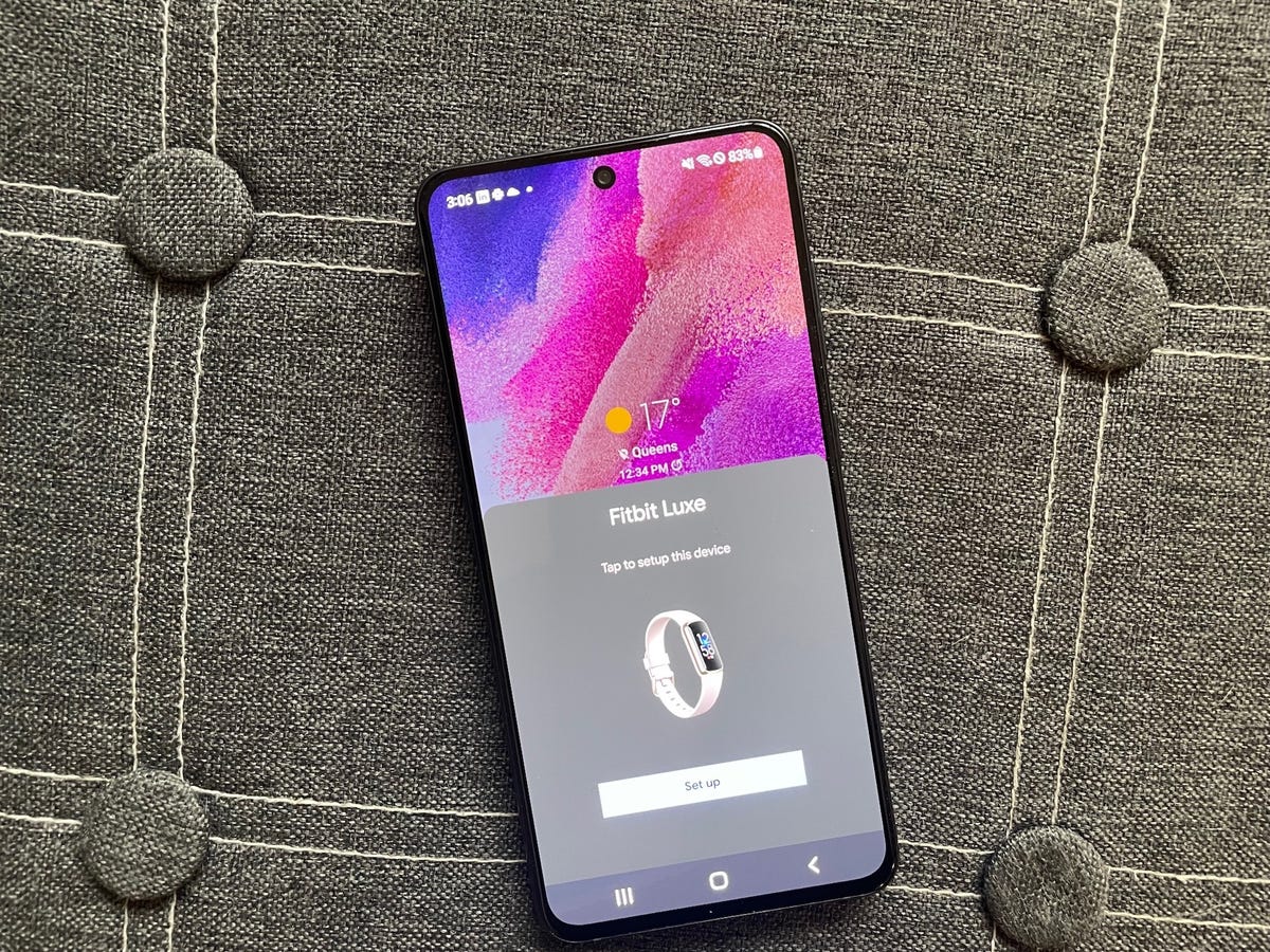 An Android phone showing Fitbit Luxe setup