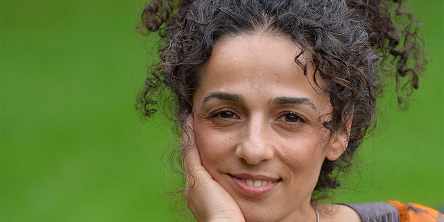 Masih Alinejad, 37, a Britain-based Iranian journalist, poses for a portrait in London, Oct. 8, 2013. Alinejad, a former reporter in Iran, left the country a week before the 2009 elections to study abroad and stayed outside after the unrest and crackdown on reformist press. 