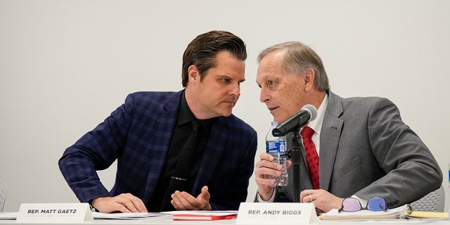 (L-R) Rep. Matt Gaetz, R-Fla., talks with Rep. Andy Biggs, R-Ariz., on November 14, 2022 in Washington, DC. 