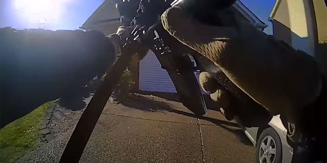 Nashville SWAT team approaches home of Mark Capps with their guns drawn. 