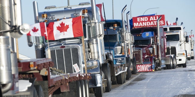 Lines of trucks block the U.S.-Canada border during a demonstration in Coutts, Alberta, on Feb. 2, 2022, a day before Pastor Artur Pawlowski delivered a speech that landed him in prison.