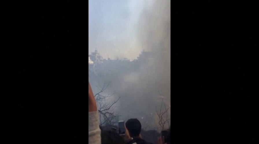 Bystanders film aftermath of Nepal plane crash that killed at least 68
