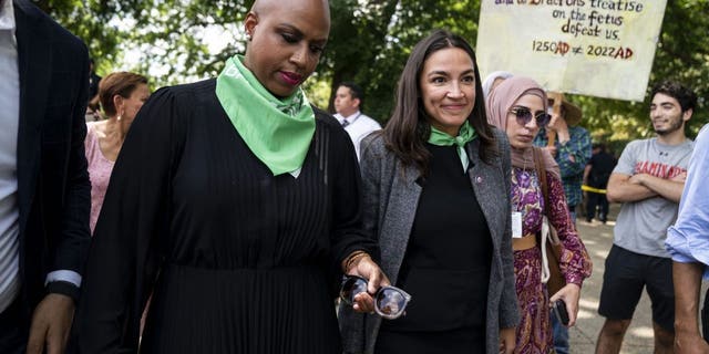 Rep. Ayanna Pressley (D-MA) and Rep. Alexandria Ocasio-Cortez (D-NY) are released from being detained after participating in a sit-in outside the Supreme Court of the United States during a sit-in protesting the high court overturning Roe v. Wade with activists from Center for Popular Democracy Action (CPDA) on Capitol Hill on Tuesday, July 19, 2022 in Washington, DC. 