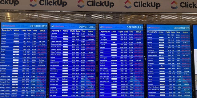 A message board shows departures at Ronald Reagan Washington National Airport in Arlington, Va., on Wednesday, Jan. 11. 2023. A computer outage at the Federal Aviation Administration brought flights to a standstill across the U.S. on Wednesday, with hundreds of delays quickly cascading through the system at airports nationwide. 
