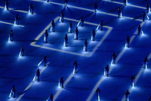 Dancers light up the ground during the opening ceremony.