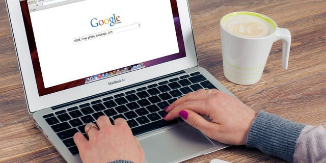 Photo of a person accessing the Google search engine.