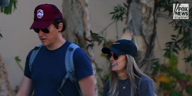 Matt Hutchins takes an energetic walk with a female friend in Los Angeles on Saturday, January 21, 2023. Hutchins is the widow of Halyna Hutchins who was shot dead on the set of Rust, for which actor, Alec Baldwin has been charged with involuntary manslaughter.