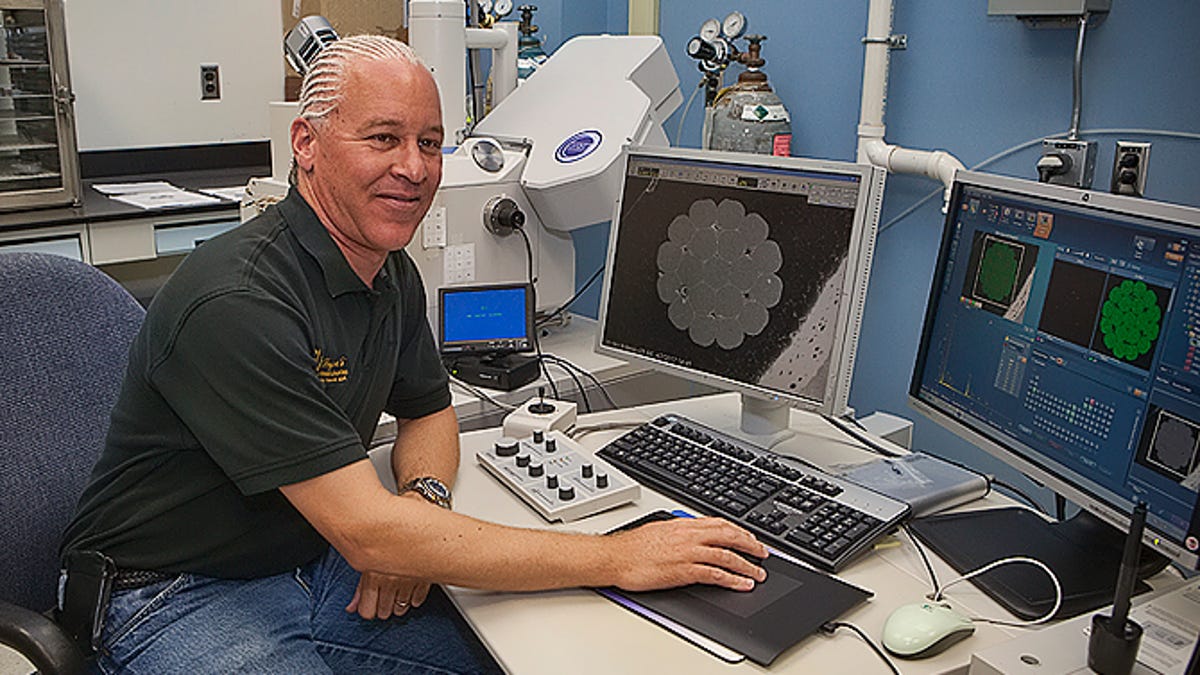 Robert Bryant at a desk with PCs and lab equipment