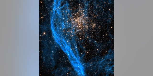 This Hubble image shows the star cluster NGC 1850, located about 160,000 light-years away. For this image, two filters were used with the camera to gather data, one at visible wavelengths, the other at near-infrared wavelengths.