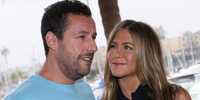 Adam Sandler and Jennifer Aniston attend a photocall for Netflix's "Murder Mystery."