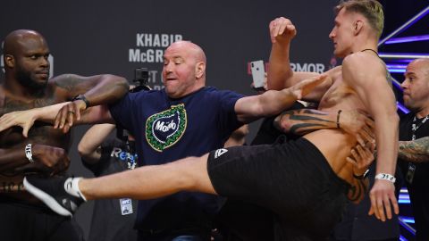 White gets in between Derrick Lewis (left) and Alexander Volkov.