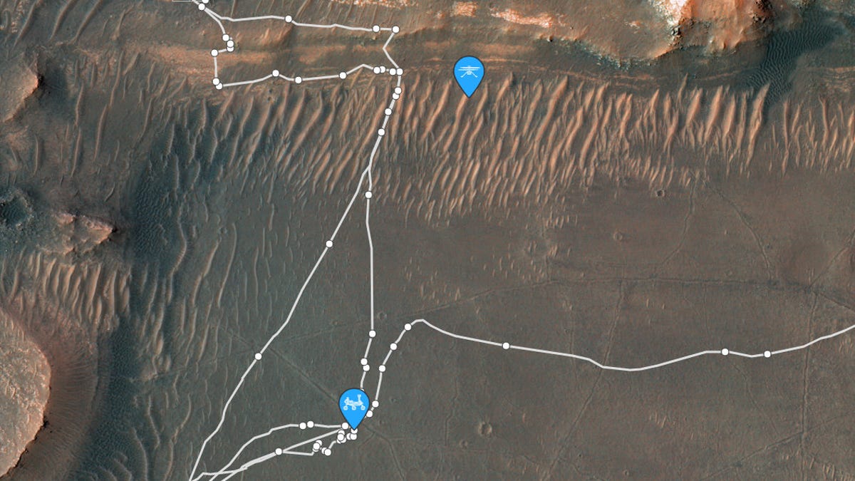 Top-down satellite map of mars shows part of Jezero Crater along with rover paths in white and Percy and Ingenuity locations marked in blue.