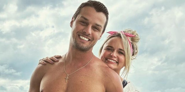 Miranda Lambert celebrates her fourth wedding anniversary by posting a shirtless photo of her husband.