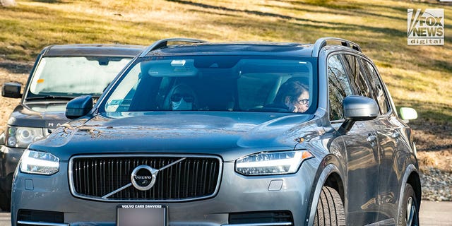 A car with the Walshe children driving away from Walshe home on Chief Justice Cushing Highway, Cohasset, Massachusetts. It is being driven by friends/relatives, one of whom was seen driving a red car Saturday. 
