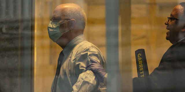 Robert Hadden waits in line at the federal court, on Jan. 9, 2023, in New York. Hadden is a doctor who was accused of abusing over 150 patients.