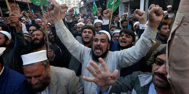 Protestors chant slogans against the burning of the Quran, a Muslim holy book, by a Danish anti-islam activist, in Peshawar, Pakistan, on Jan. 27, 2023.