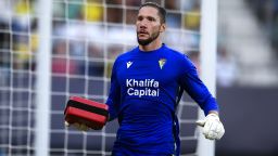 Cadiz's goalkeeper Jeremias Ledesma brings a defibrillator as a supporter is attended by a medical team at the stand during Spanish la Liga soccer match between Cadiz FC and FC Barcelona at the Nuevo Mirandilla stadium in Cadiz, southern Spain, Saturday, Sept. 10, 2022. (AP Photo/Jose Breton)