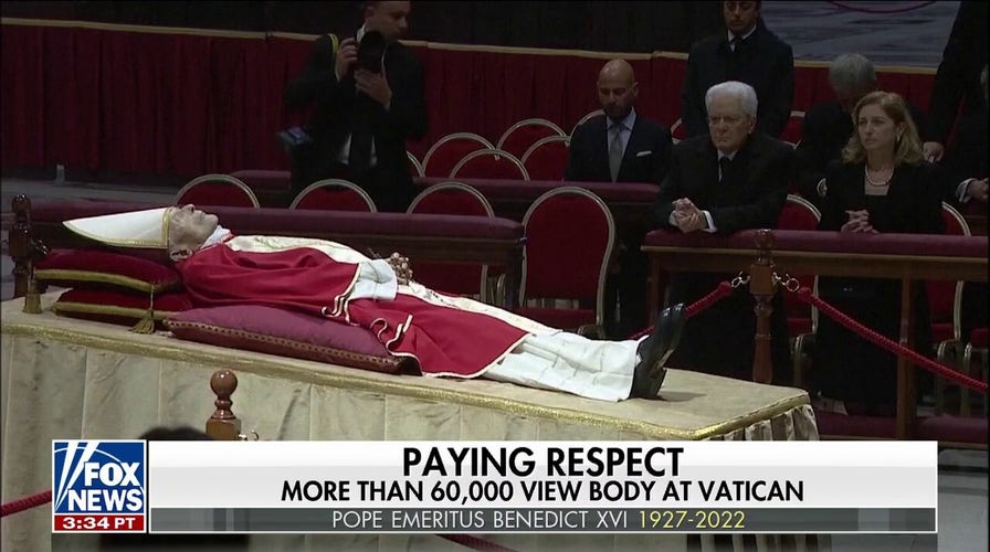 Pope Emeritus Benedict XVl lies in state as thousands of mourners pay tribute