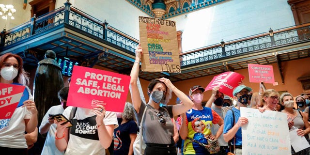 People rally inside the South Carolina State House as lawmakers prepare to vote on legislation related to an abortion ban in the state, Aug. 30, 2022.