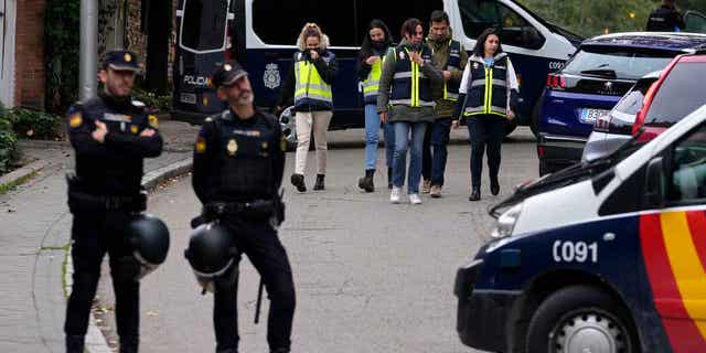 Police officers stand guard next to the Ukrainian embassy in Madrid, Spain, on Nov. 30, 2022. Spain’s National Court said on Jan. 27, 2023, it had charged a retired man with terrorism after he allegedly sent letters containing explosive material to multiple government officials, including the Ukrainian embassy in Spain.