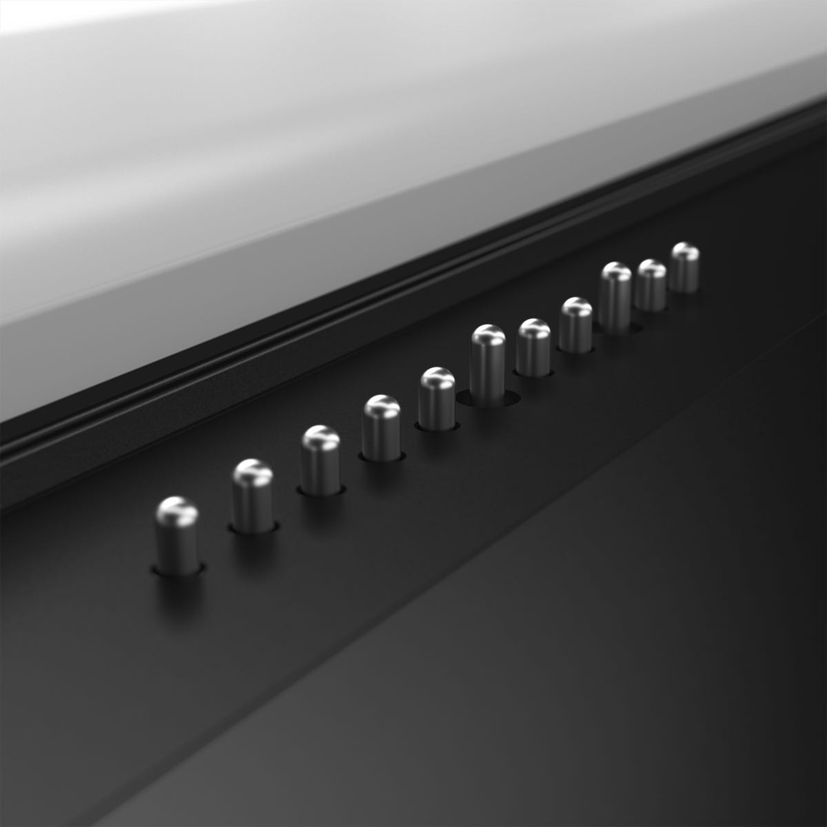 Close up of the magnetic pins of the Magic Bay Light attachment