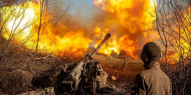 Ukrainian servicemen fire a 130 mm towed field gun M-46 on a front line, as Russia's attack on Ukraine continues, near Soledar, Donetsk region, Ukraine, in this handout image released November 10, 2022. 