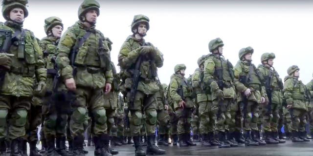 Russian recruits stand prior to their military training at the Patriot Park outside in Moscow, Russia, Saturday, Oct. 1, 2022.