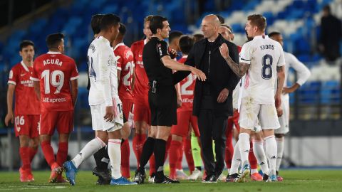 Zidane interacts with referee Juan Martinez Munuera after the La Liga match between Real Madrid and Sevilla.