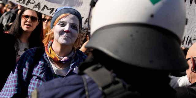 Art students gather during a protest outside parliament in Athens, Greece, on Feb. 2, 2023. Students are striking for a second day, closing theaters and halting television shoots to protest changes in the qualification system of civil service jobs. 