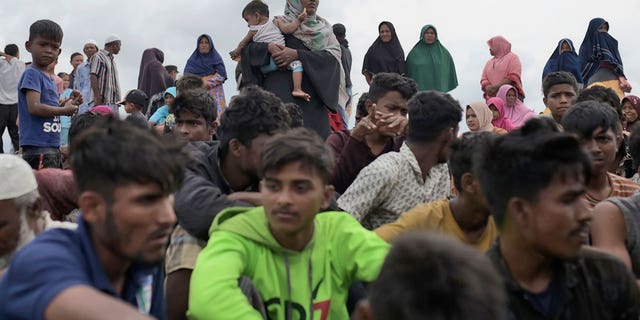 Ethic Rohingya people rest on Lampanah Leungah beach after landing in Aceh Besar, Aceh province, Indonesia, on Feb. 16, 2023.