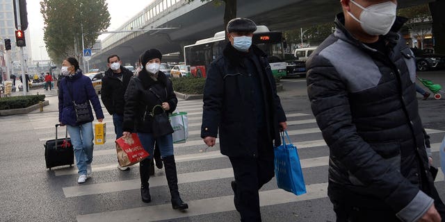 A leading Chinese scientist has advised that the rest of the world should "calm down" over new variants of COVID-19 detected in his country.