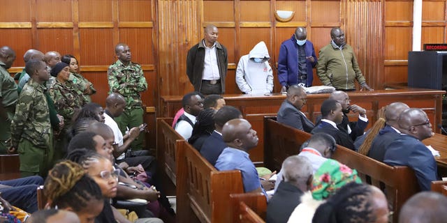 Kenya police officers in dock from left to right sentenced Peter Ngugi Kamau, 20 years, Sylvia Wanjiku Wanjohi, 24 years, Stephen Cheburet Morogo, 30 years and Fredrick Leliman, life sentence at Kenya's Milimani court on Feb. 3, 2023.