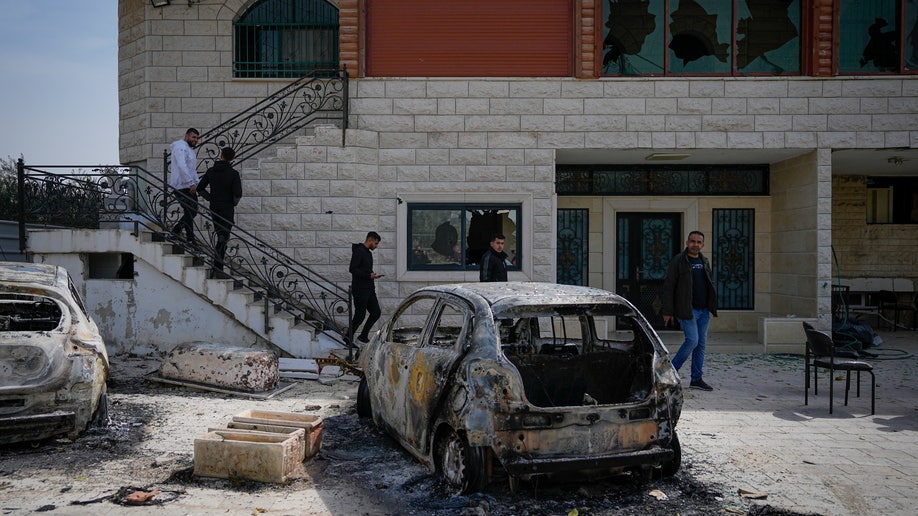 Damaged house and cars near Nablus