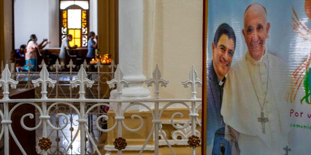 A poster featuring Bishop Rolando Alvarez and Pope Francis hangs inside the Cathedral in Matagalpa, Nicaragua, Aug. 19, 2022. 