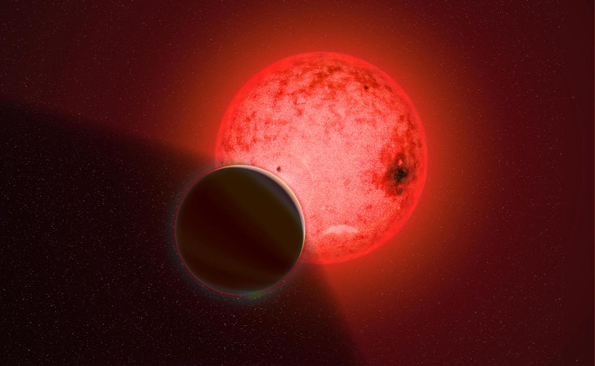 Another view of the glowing star and its gas giant planet in orbit around it.