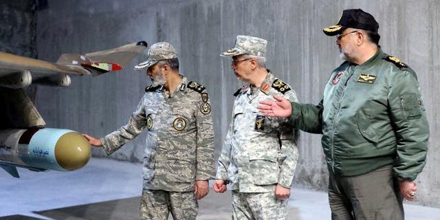 Iran's Army chief, Major General Abdolrahim Mousavi and Iranian Armed Forces Chief of Staff Major General Mohammad Bagheri visit the first underground air force base, called "Eagle 44" at an undisclosed location in Iran, in this handout image obtained on Feb. 7, 2023. 