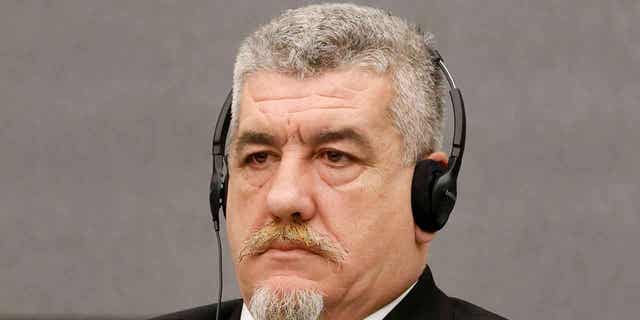 Pjeter Shala, a former Kosovo Liberation Army member, attends his trial in The Hague, Netherlands, on Feb. 21, 2023. 