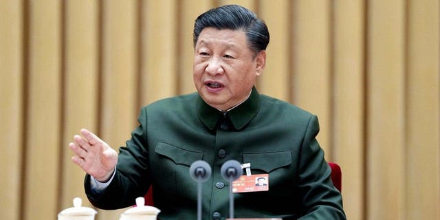 Chinese President Xi Jinping, also general secretary of the Communist Party of China Central Committee and chairman of the Central Military Commission, attends a plenary meeting of the delegation of the People's Liberation Army PLA and the People's Armed Police Force during the first session of the 14th National People's Congress NPC in Beijing March 8, 2023.