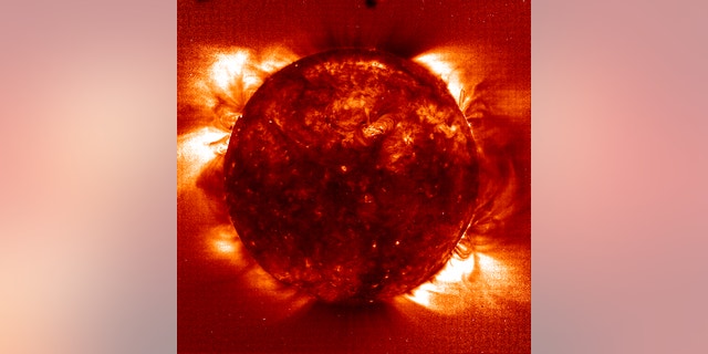 An image of the sun taken in 1997 shows the hot temperatures of the corona (in lighter colors) compared to cooler temperatures of the surface of the sun (in darker colors).
