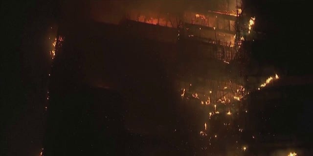 A fire at a Hong Kong skyscraper construction site broke out Thursday, sending flaming embers onto the street below.