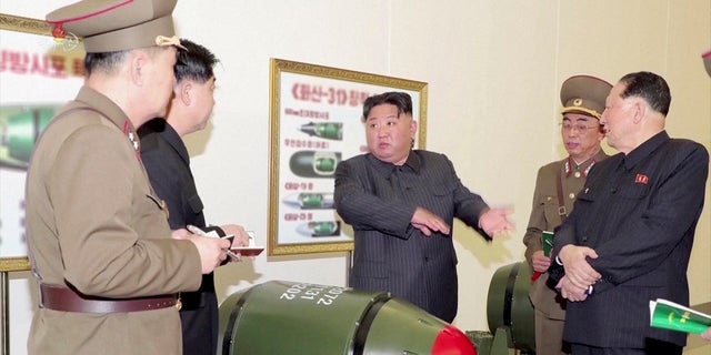 North Korean leader Kim Jong Un, center, on Tuesday ordered his country to ramp up production of "weapon-grade nuclear materials."