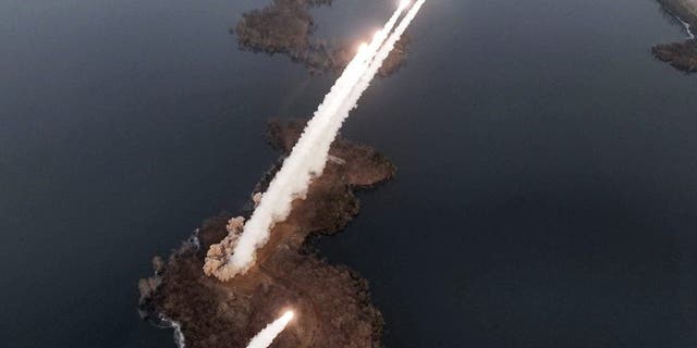 An artillery drill at an undisclosed location in North Korea, Thursday, March 9, 2023.