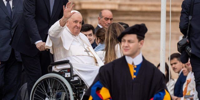 Pope Francis greets and blesses the faithful during his traditional Wednesday General Audience at St. Peter's Square in Vatican City. 
