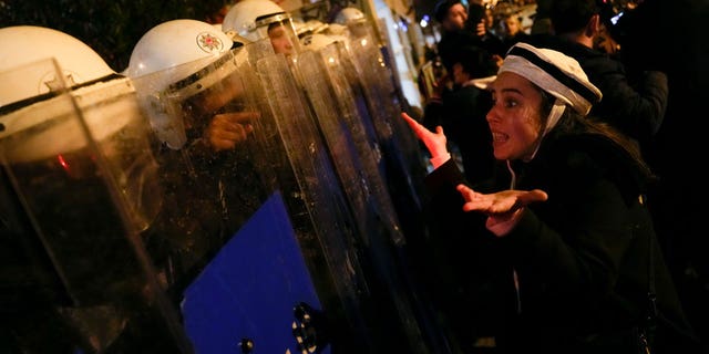 Turkish women protesting a ban on International Women's Day marches stared down police donning riot gear in Istanbul.