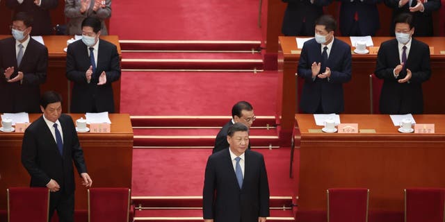 Li Zhanshu of National People's Congress (NPC), Chinese President Xi Jinping and Chinese Premier Li Keqiang attend the opening of the first session of the 14th Chinese People's Political Consultative Conference (CPPCC) at The Great Hall of People on March 4, 2023, in Beijing.