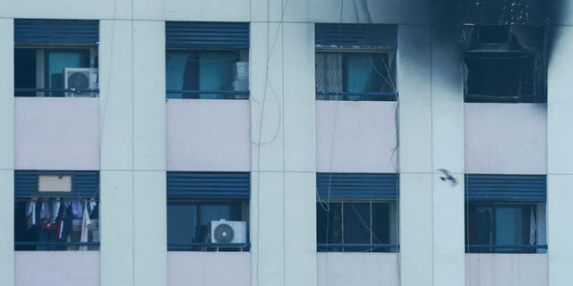 Char marks are seen after a fire broke out at an apartment in Dubai, United Arab Emirates, on April 16, 2023. 
