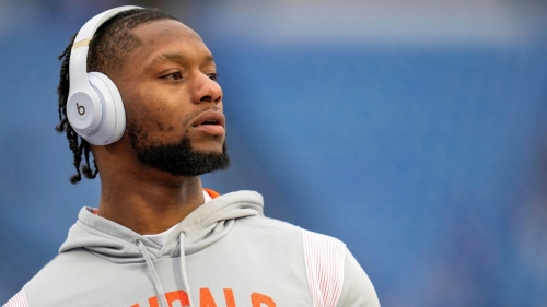 Joe Mixon throws passes with fans during warmups before the NFL divisional playoff football game on January 22, 2023.