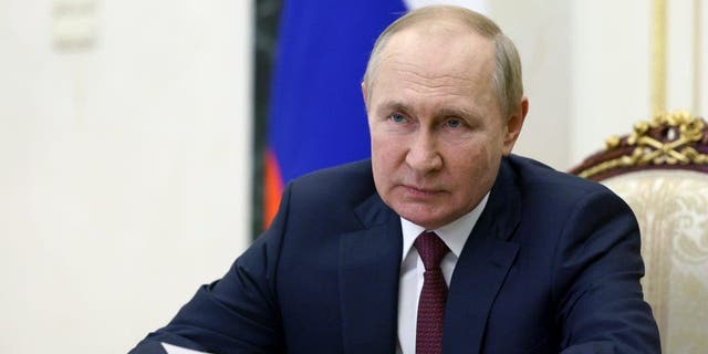 Russian President Vladimir Putin chairs a meeting with the heads of delegations to the 18th meeting of the Conference of Heads of Security and Intelligence Agencies of the Commonwealth of Independent States members via videoconference at the Kremlin in Moscow, Russia, Thursday, Sept. 29, 2022. 