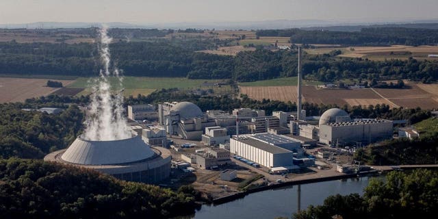 FILE - Water vapor rises from the cooling tower of nuclear power plant of Neckarwestheim II in Neckarwestheim, Germany, Aug. 22, 2022.