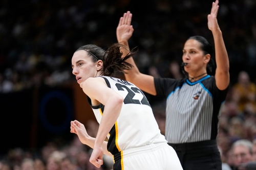 Iowa star Caitlin Clark runs back on defense after making a 3-pointer in the second half.